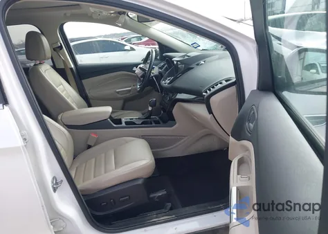 2017 Ford Escape Titanium z USA, uszkodzony, nr VIN 1FMCU9J96HUE25242